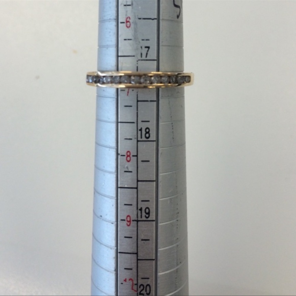 Gold wedding band with diamonds